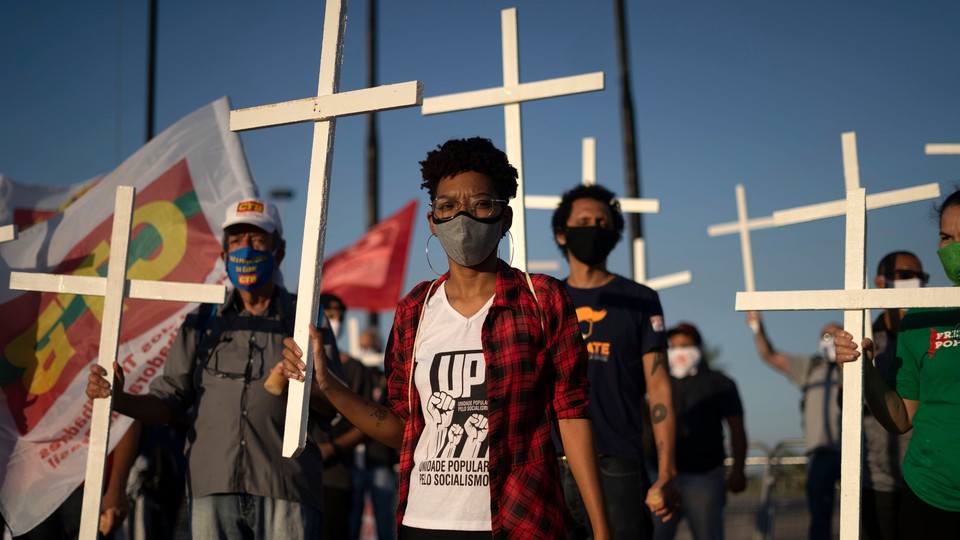 Crowd holding crosses at a protest