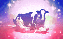 A woman hugging a cow with shining lights.