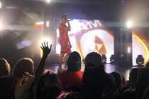 Jake Paul on stage holding a microphone