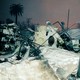 Color photograph of a burned house with melted plastic in Los Angeles