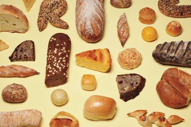 photo of many different types of breads on yellow background