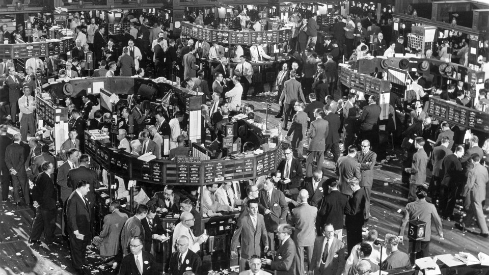 A 1948 black-and-white photograph of the New York Stock Exchange floor, filled with traders