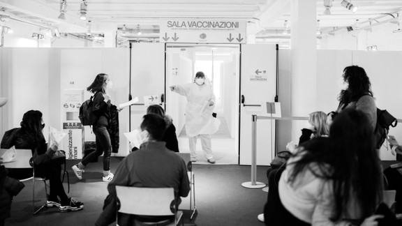 A nurse calls on patients waiting for the AstraZeneca COVID-19 vaccine at the Museum of Science and Technology in Milan, March 22.