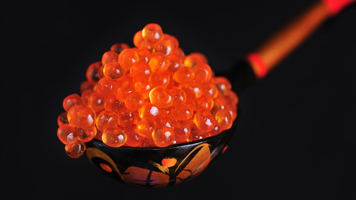 A spoonful of red caviar