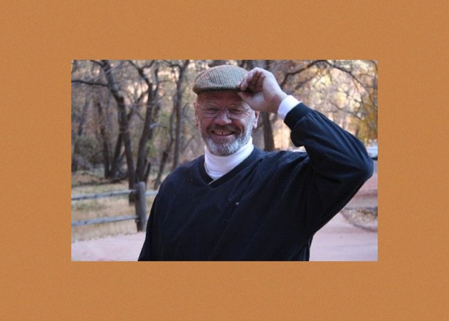 A photo of the author's father smiling and tipping his hat