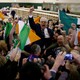 A Sinn Fein candidate celebrates with supporters after the announcement of voting results in Ireland's national election.