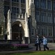 Georgetown University workers walk across campus with cleaning supplies