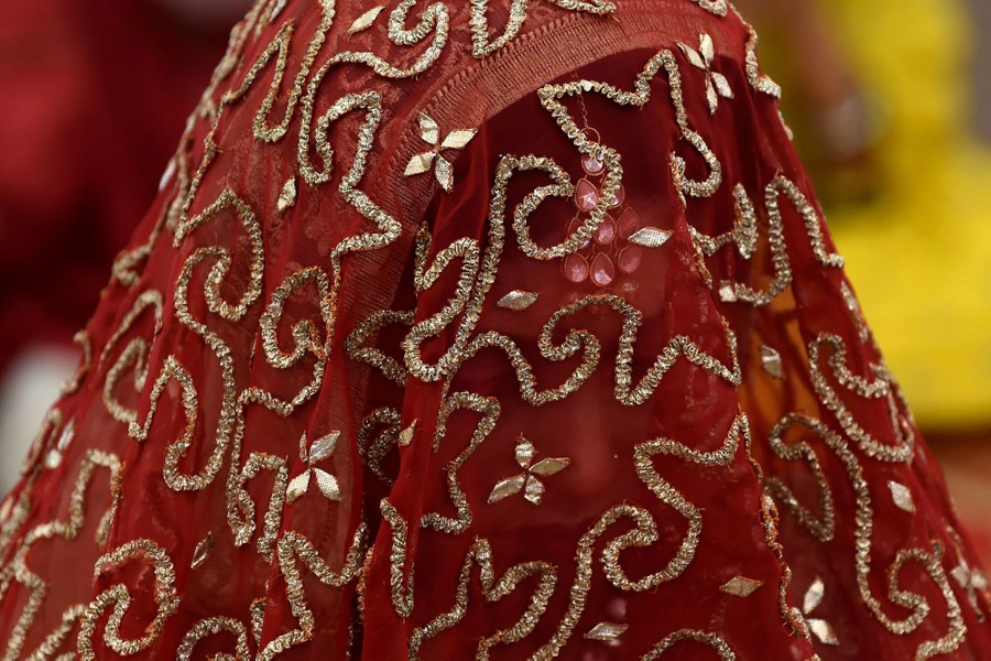 A portrait of a woman wearing a colorful veil.