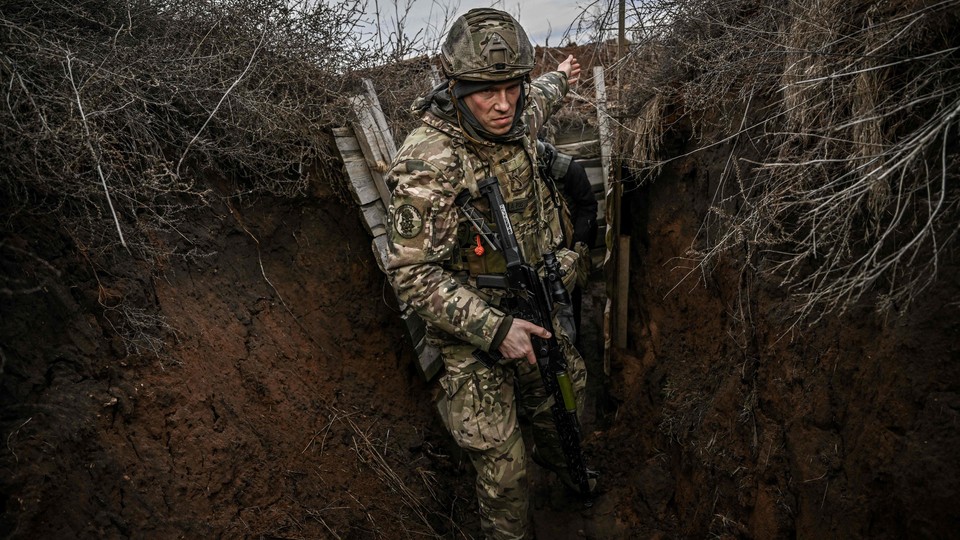 Ukrainian troops outside the town of Novoluhanske