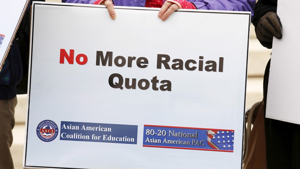 A sign says "No More Racial Quota"