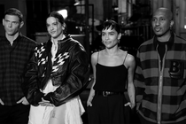 Mikey Day, musical guest Rosalía, host Zoë Kravitz, and Chris Redd stand next to one another during "SNL" promos on March 12, 2022