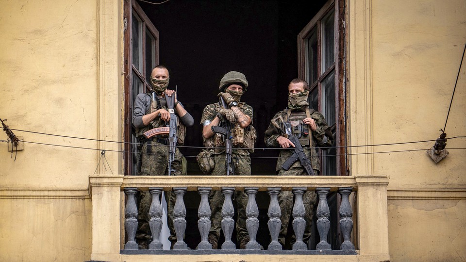 Three soldiers on a balcony