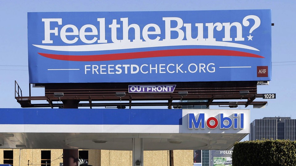 A billboard shows a play on the presidential candidate Bernie Sanders's campaign slogan "Feel the Bern." It's actually promoting testing for sexually transmitted diseases.