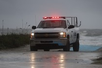 A lifeguard patrols a the beach ahead of Hurricane Matthew on Thursday in Jacksonville Beach, Florida.