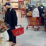 a man in a grocery store in the early morning