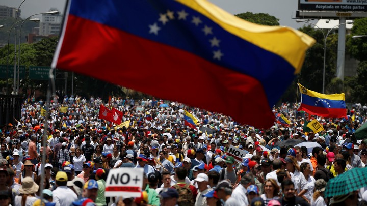 Demonstrators march during an opposition rally in Caracas, Venezuela.