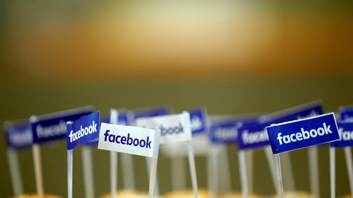 Small flags with Facebook's logo are pinned into snacks