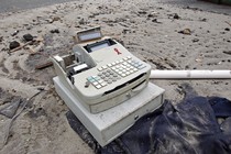 A cash register among debris