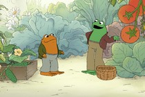 The main characters of "Frog and Toad" in a garden, surrounded by lettuce and tomatoes
