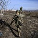 Ukrainian serviceman walking away from the camera