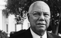 Colin Powell looks past the camera outside the White House.