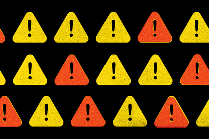 Illustration of yellow and orange triangles, each containing a black exclamation point, on a black background