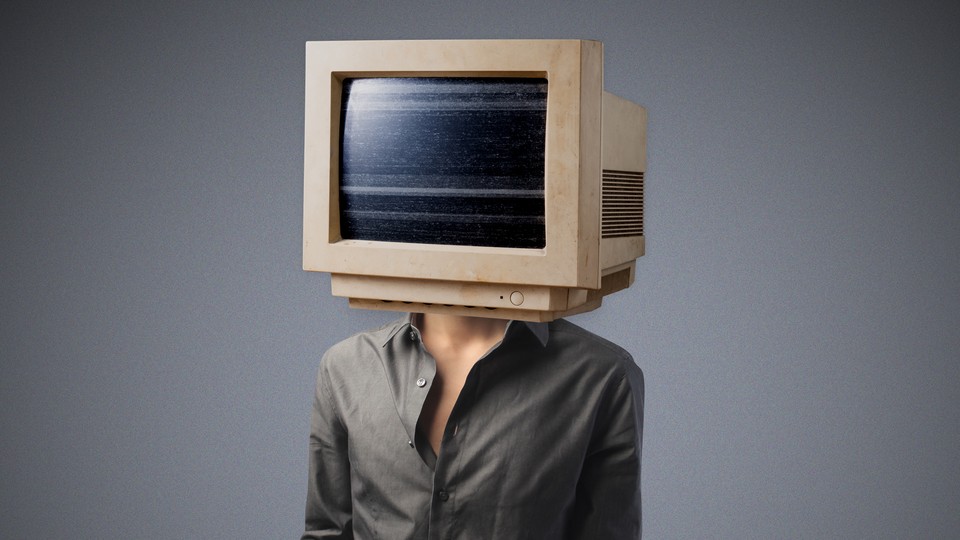 A person whose head has been replaced with a bulky desktop monitor