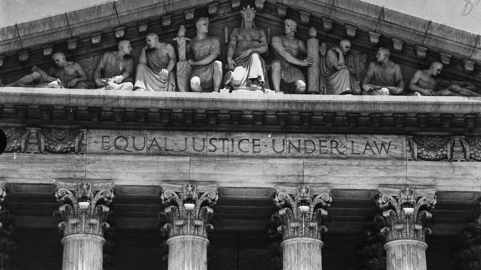 The phrase "Equal Justice Under Law" carved into the pediment of the Supreme Court Building in Washington