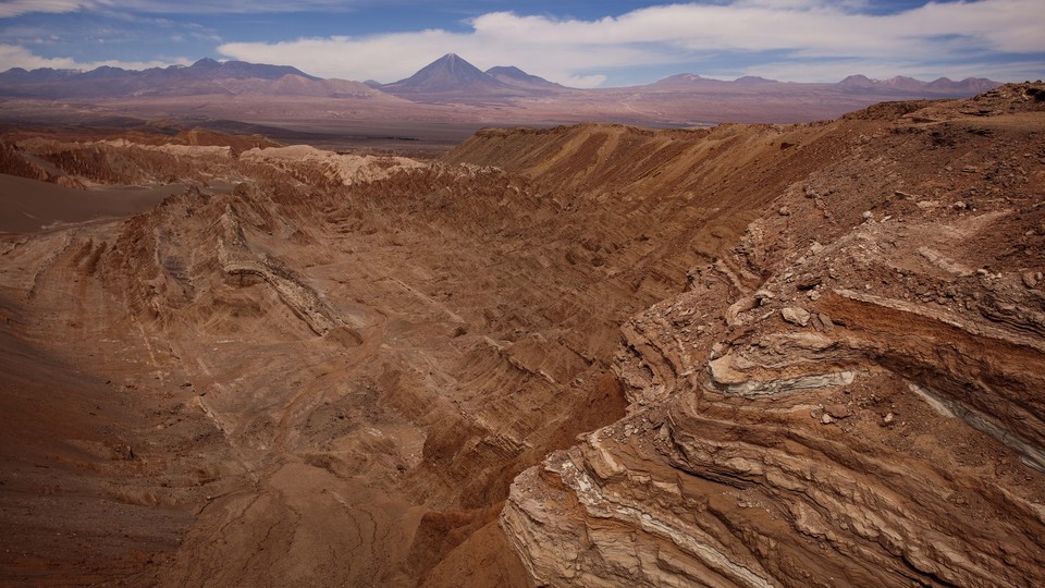 The dry, red, rocky landscape of the Atacama Desert.