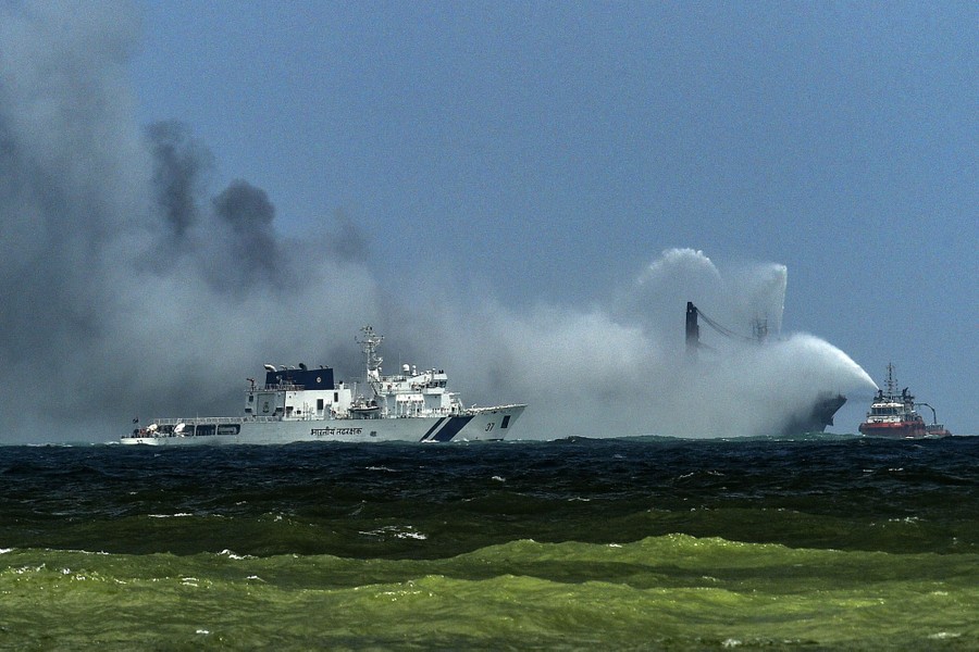 Firefighting boats attempt to put out a ship fire.