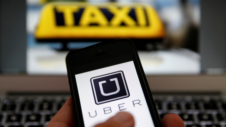 A cell-phone user uses the Uber app