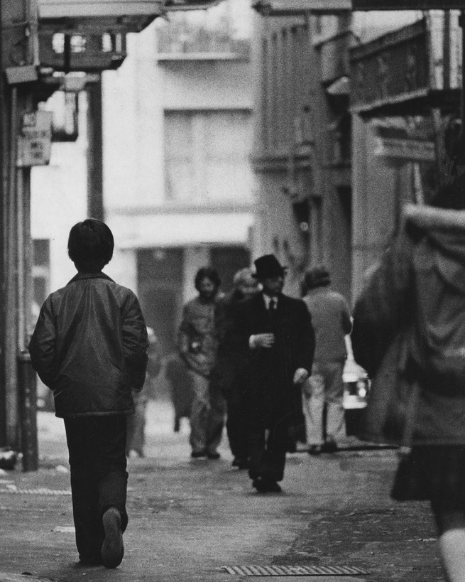 Picture of a young boy in an alley in Chinatown, San Francisco