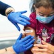 a child getting a COVID vaccine