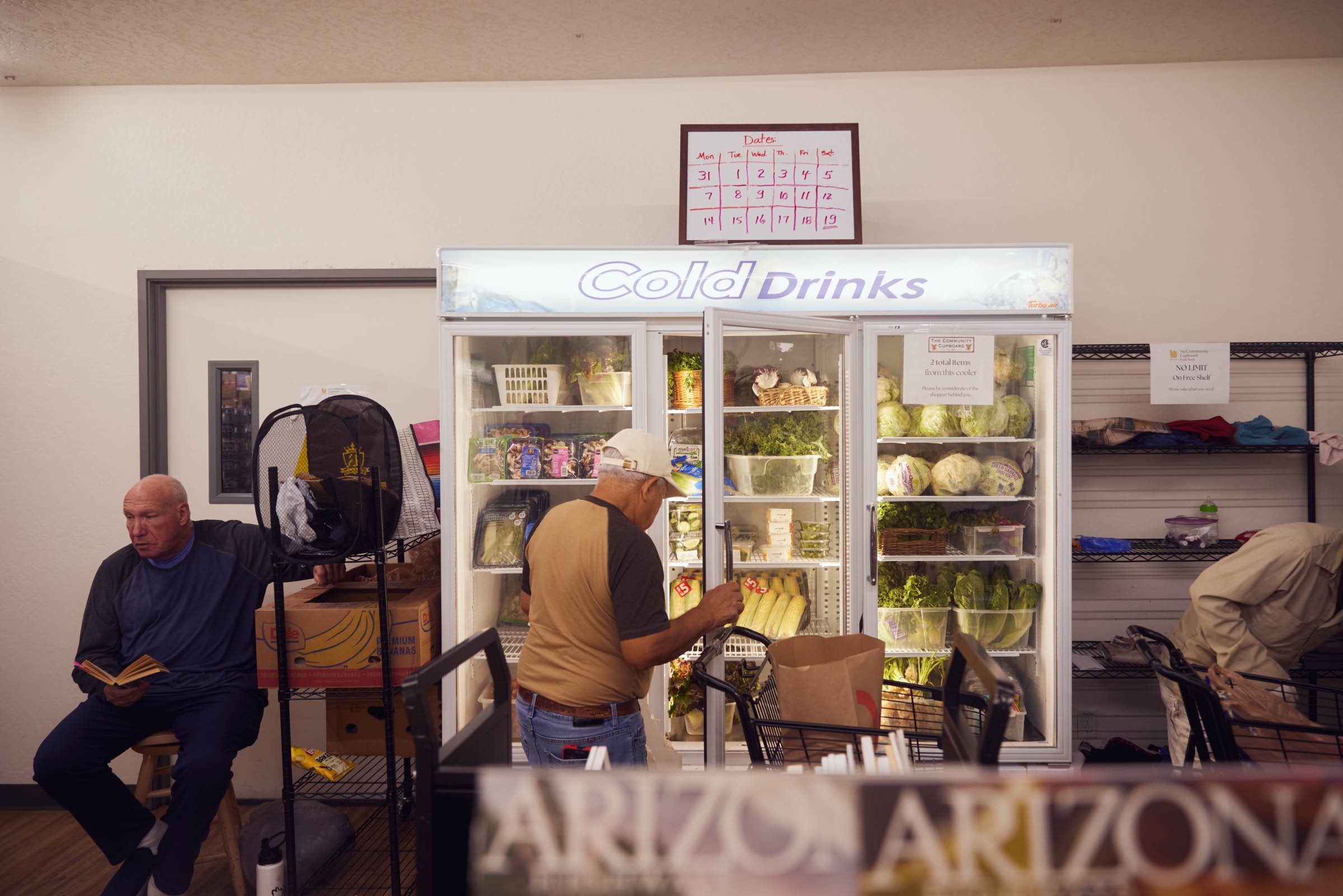 people shop for produce in a store