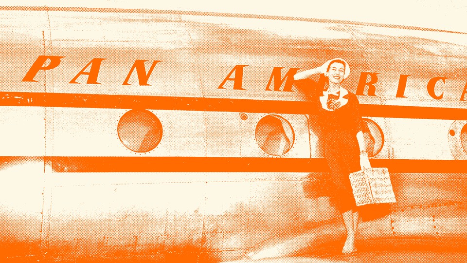 A woman poses next to a Pan America plane