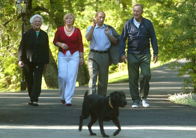 From right, former U.S. President George H.W. Bush, Russian President Vladimir Putin, Putin's wife Lyudmila and Barbara Bush walk around Putin's residence in Sochi in September, 2003.