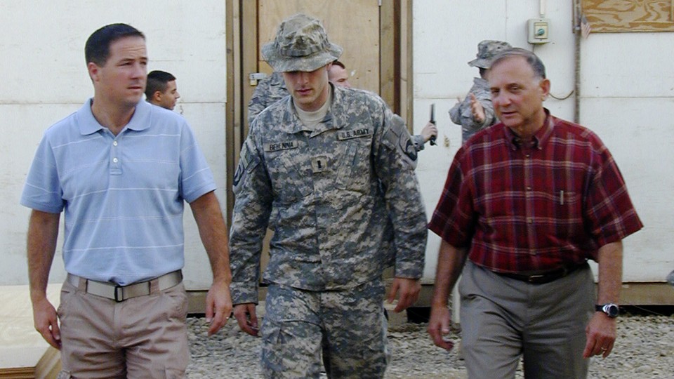 Lt. Michael C. Behenna, center, walked out of a courtroom flanked by his defense attorneys in 2008.