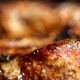 A close-up of a sizzling pork steak