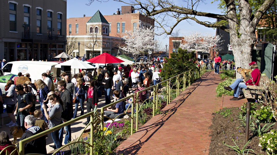 Neighbors gather at a farmers' market in Arkansas.