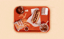 A GIF of a tray full of food that disappears