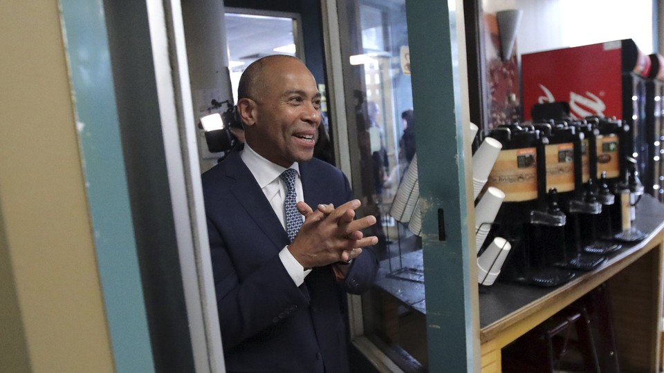 Deval Patrick enters The Bridge Cafe in Manchester, New Hampshire.
