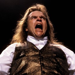 Meat Loaf singing in a shiny waistcoat