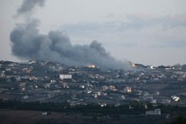 Smoke comes from the Lebanese village of Taybeh