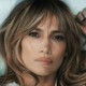 Close-up shot of Jennifer Lopez lying down and looking serious