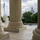 The Capitol is framed by the columns at the U.S. Supreme Court, in Washington, D.C.