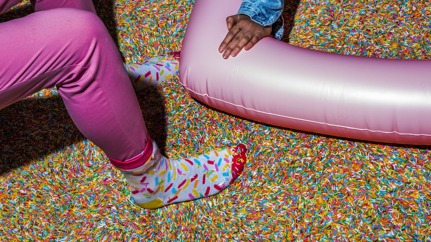 Museum of Ice Cream employees in a sprinkle pool