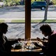 Two people dining indoors at a restaurant