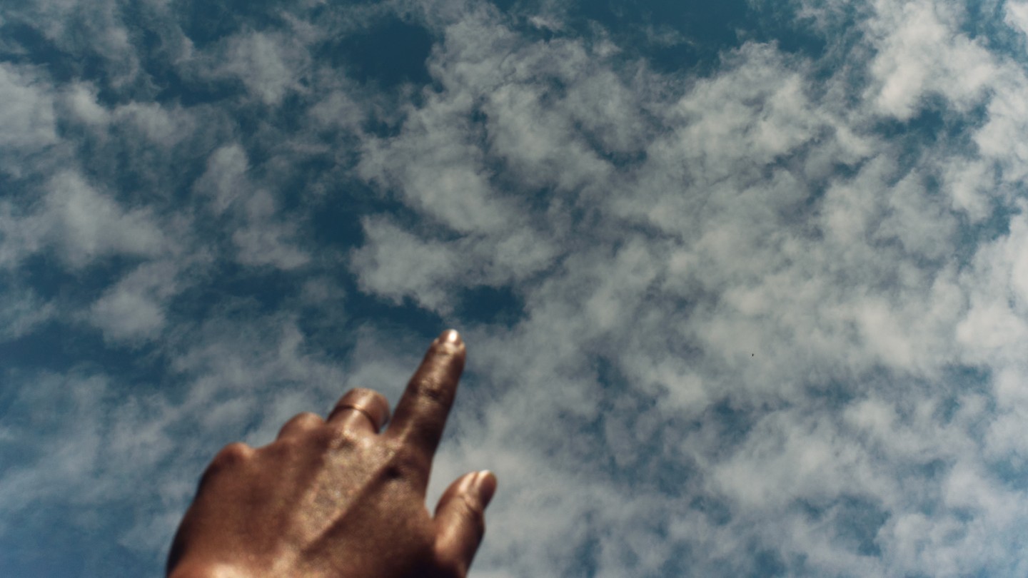 hands of god in clouds