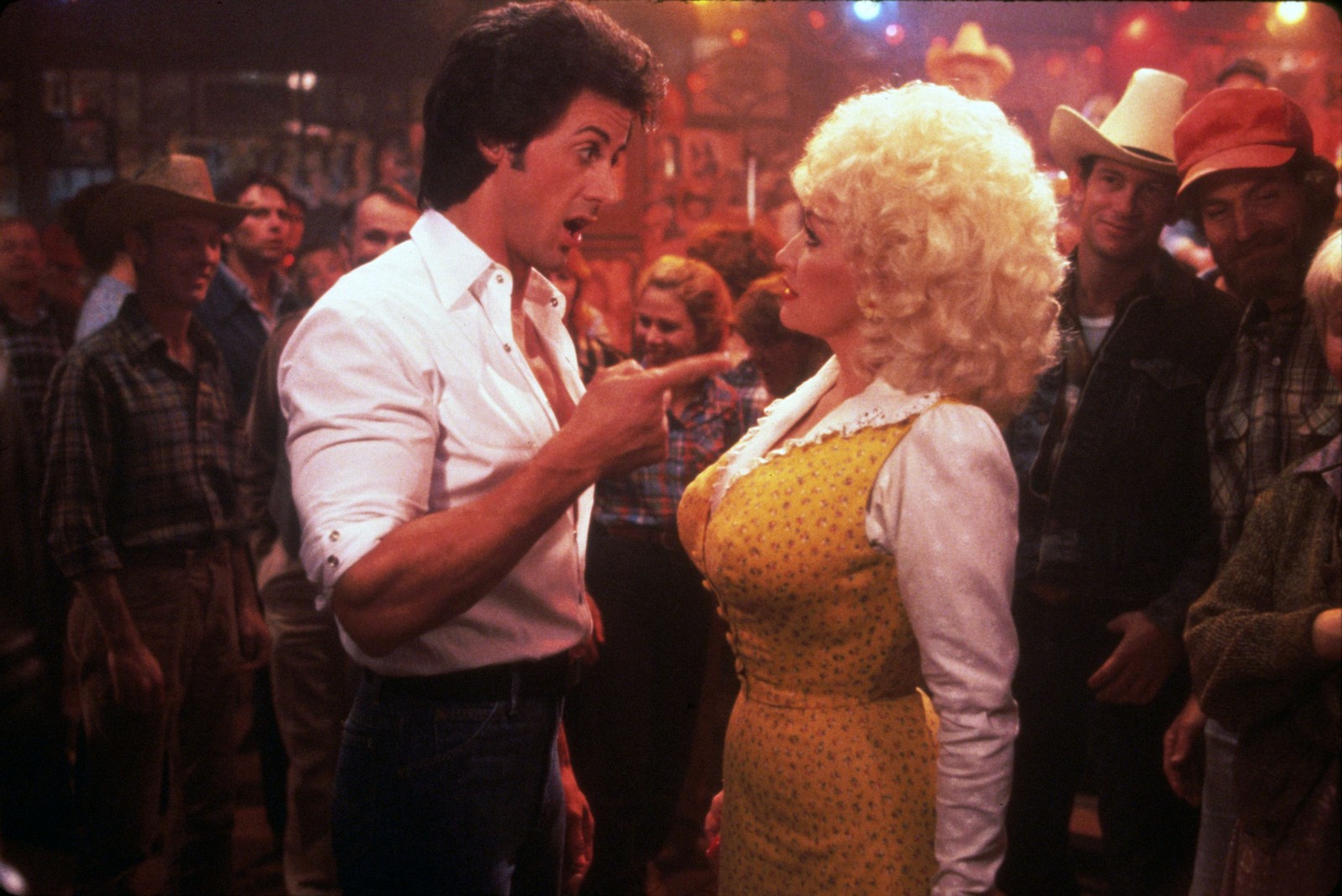 Sylvester Stallone and Dolly Parton appear on set in the 1984 movie 'Rhinestone.'