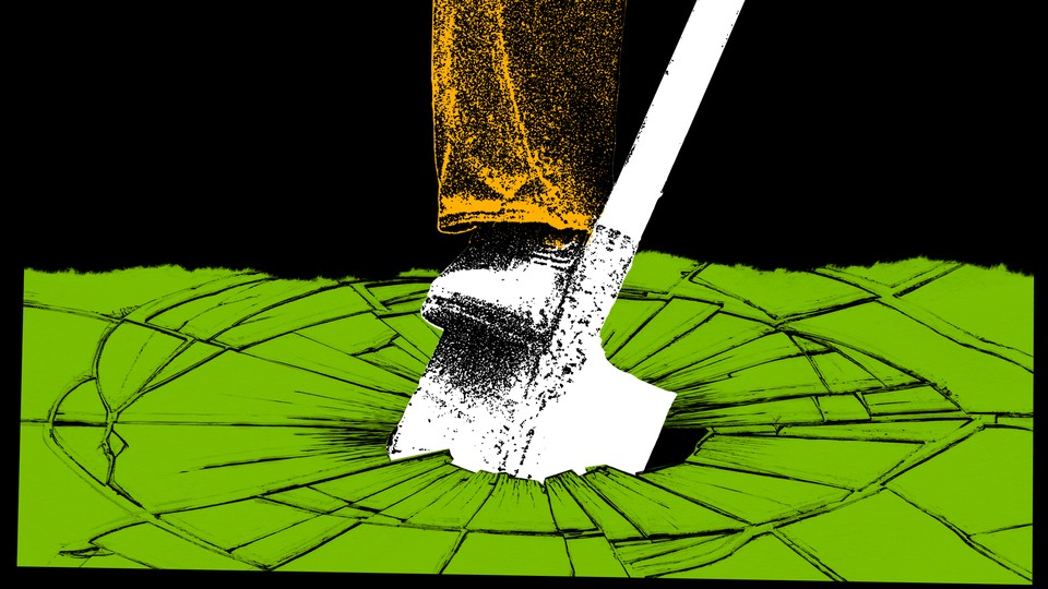 A boot pushes a shovel into the ground, causing cracks to appear.